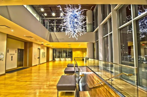 Building interior with glass art piece suspended — Stock Photo, Image