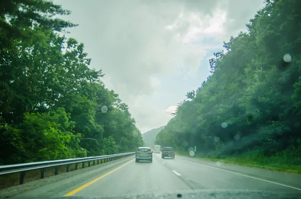 Driving on an american highway system in bad weather — Stock Photo, Image