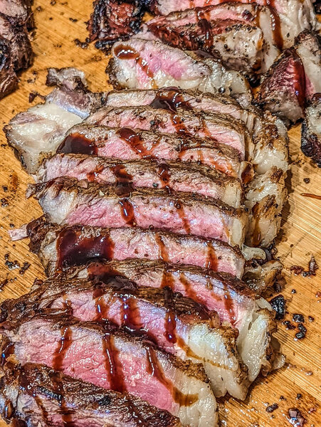 Cooked and sliced to perfection 30 day dry aged ny strip beef and bison ribeye
