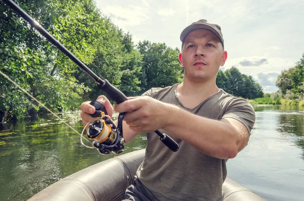 Fisherman Sits Boat His Hand Spinning Rod Happy Angler Sunny — Stock Photo, Image