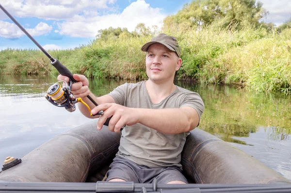 Fisherman Sits Boat His Hand Spinning Rod Happy Angler Sunny — Stock Photo, Image