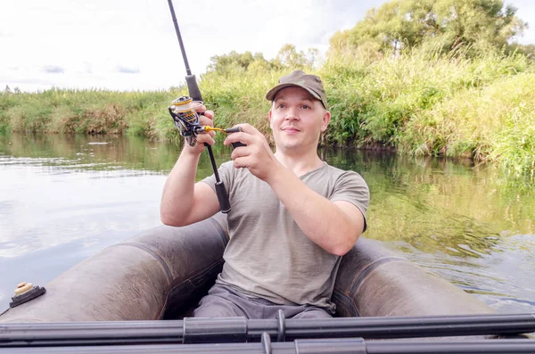 Fisherman Sits Boat His Hand Spinning Rod Happy Angler Sunny — Stock Photo, Image