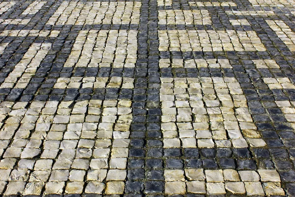 Detalhe de um pavimento típico português em Lisboa, Portugal — Fotografia de Stock