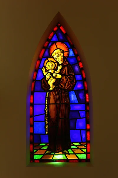 Detail of a stained glass with a siant and a child — Stock Photo, Image