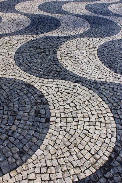 Calcada portuguesa, portugiesisches Pflaster Stockbild