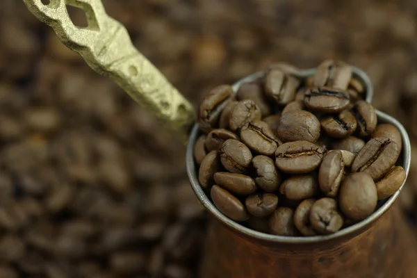 Coffee beans in pot — Stock Photo, Image