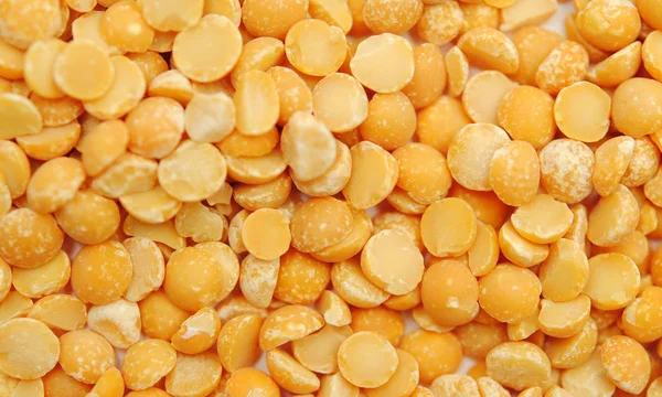 Dry split yellow peas texture background — Stock Photo, Image