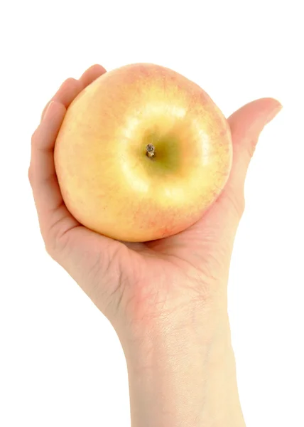 Mano femenina con una manzana — Foto de Stock