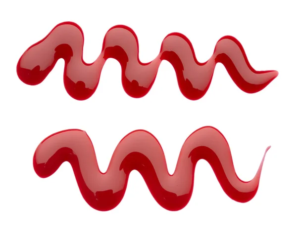 Образец капель красного лака для ногтей, выделенный на белом — стоковое фото