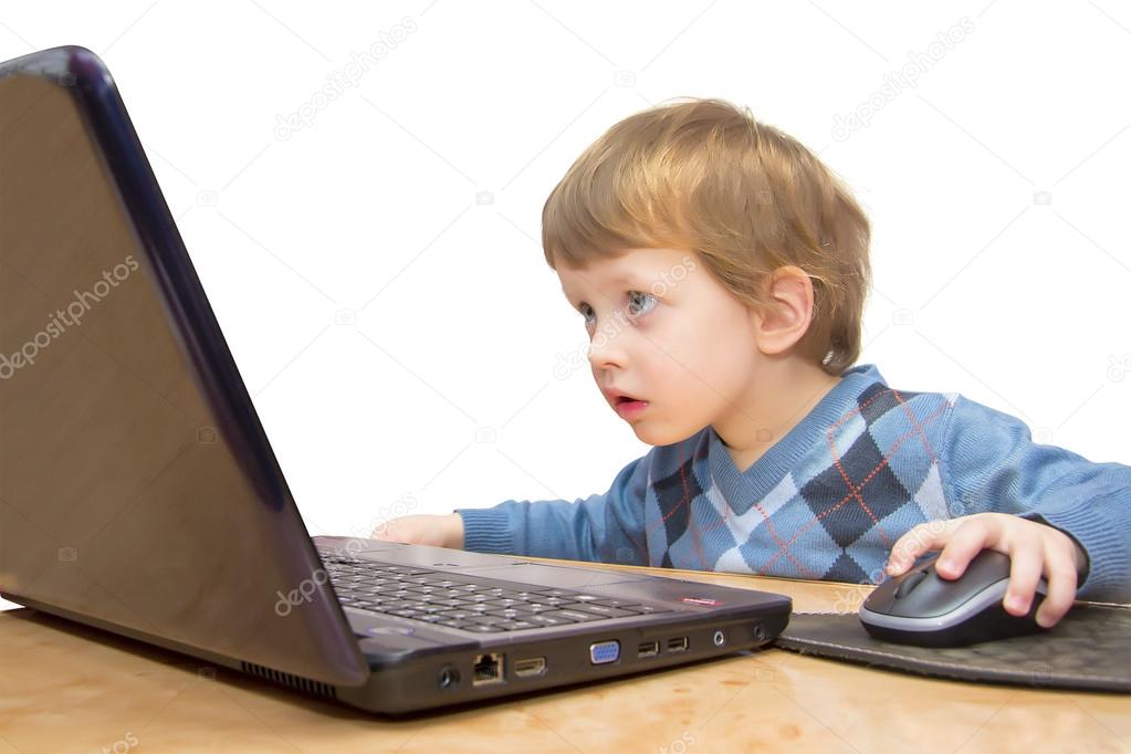 Cute three years boy with laptop isolated on white background