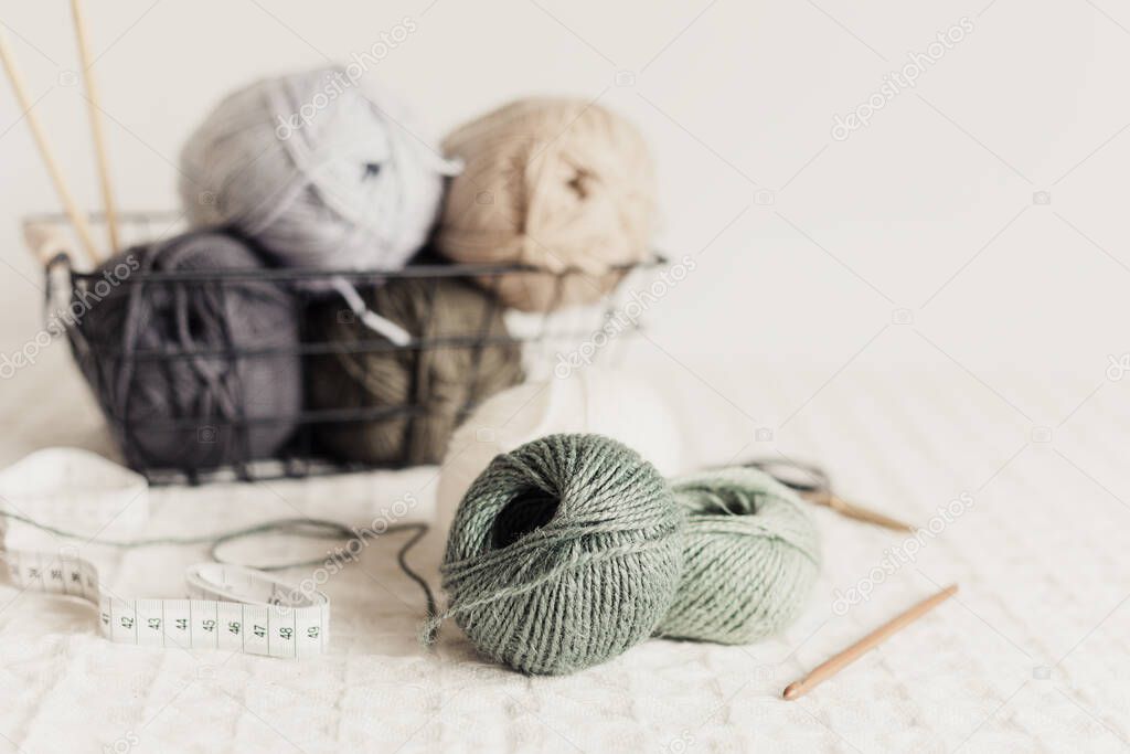 Craft hobby background with yarn in natural colors. Recomforting, destressing hobby for cold fall and winter weather