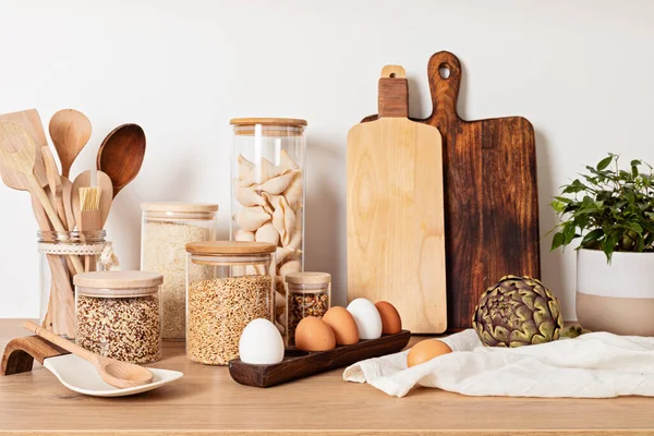 Assortment Grains Cereals Pasta Glass Jars Kitchen Utensils Wooden Table — Stock Photo, Image