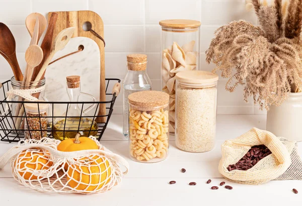 Assortment Grains Cereals Pasta Glass Jars Kitchen Utensils Wooden Table — Stock Photo, Image