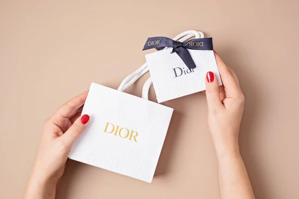 Lyon, France - January 09, 2022: Woman unboxing Dior bag. Luxury gift for holidays — 스톡 사진