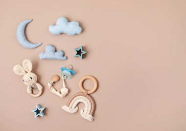 Flat lay with baby sleep accessories with pacifier and toys. Newborn sleeping rules concept