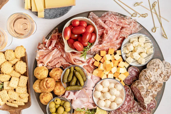 Appetizers table with different antipasti, charcuterie, snacks, cheese. Finger food for buffet party. Traditional french or italian entires. Top view