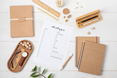 Desktop with planning template and office accessories. Organization, time managing, self-development concept. Top view, falt lay