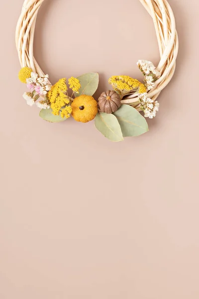Handmade wreath with dry flowers. DIY autumn decoration idea. Artisan, small business, sustainable decor for fall holidays concept