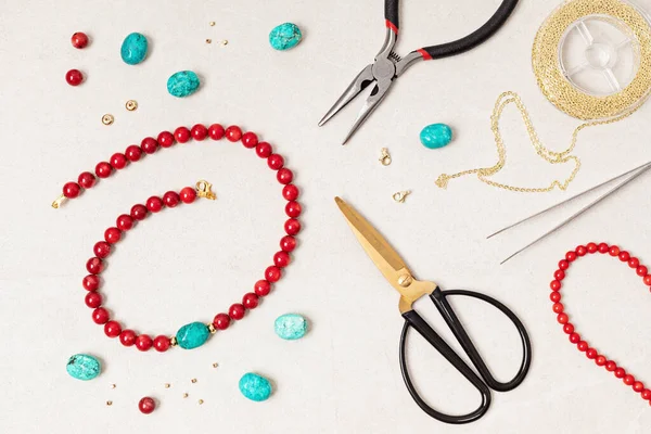 Jewelry making flatlay with semi-precious stone beads and tools. Handmade jewelry, small business, hobby concept