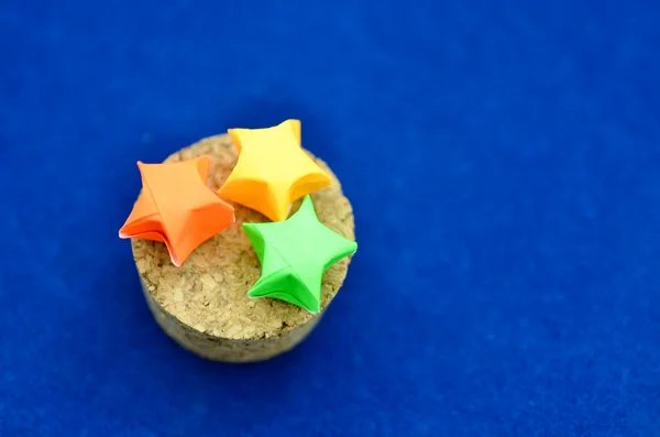 Three origami stars with cork lid — Stock Photo, Image