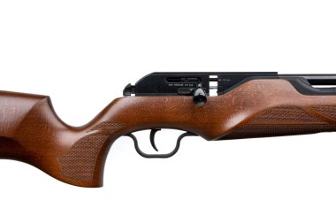 A modern air rifle with a futuristic design. Pneumatic weapons with a wooden butt for sports and entertainment. Isolate on a white background.