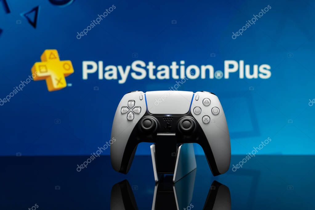 May 16, 2022, Odessa, Ukraine. White new Playstation 5 gamepad with Playstation Plus on screen, selective focus. Blue background.