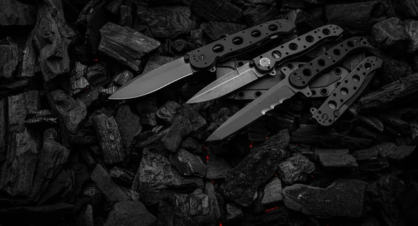 Modern Knives Black Blades Hunting Military Folding Knives Smoldering Charcoal —  Fotos de Stock