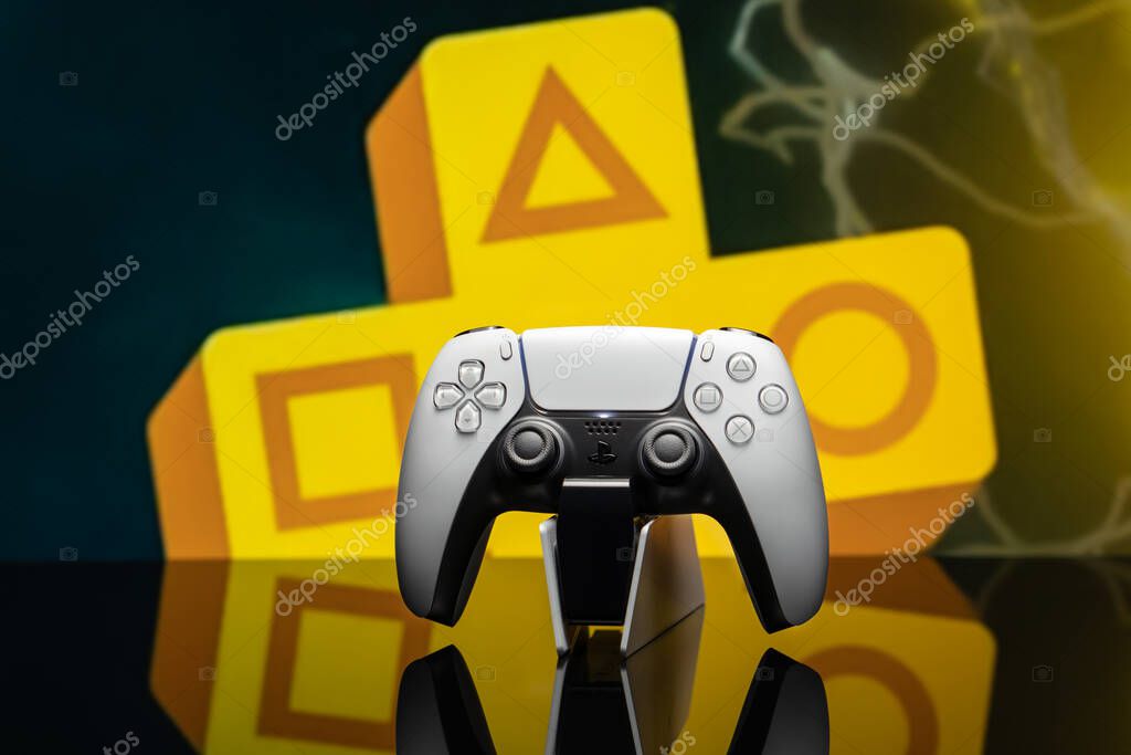 May 17, 2022, Odessa, Ukraine. White new Playstation 5 gamepad with Playstation Plus on screen, selective focus. Dark background.