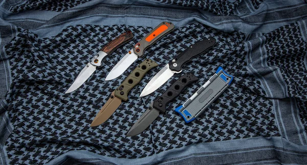 Various Pocket Knives Retractable Blades Light Fabric Background — Foto de Stock