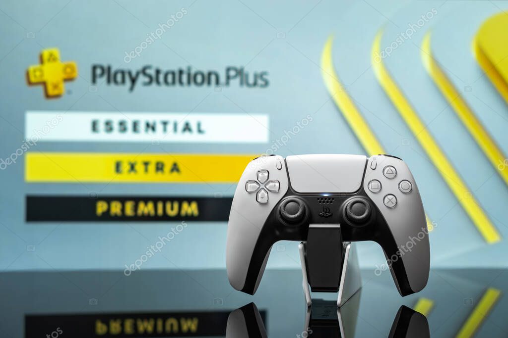 August 7, 2022, Odessa, Ukraine. White new Playstation 5 gamepad with Playstation Plus on screen, selective focus. Light background.