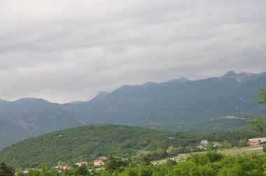 Grobnik field panorama and mountains in background. Mountain panorama view of landscape of Grobnik meadow.