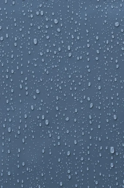 Krople wody na powierzchni metalicznej niebieski — Zdjęcie stockowe