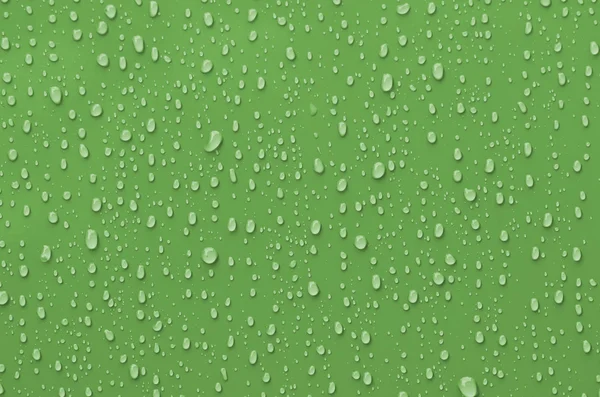 Waterdruppels op groen metalen oppervlak — Stockfoto