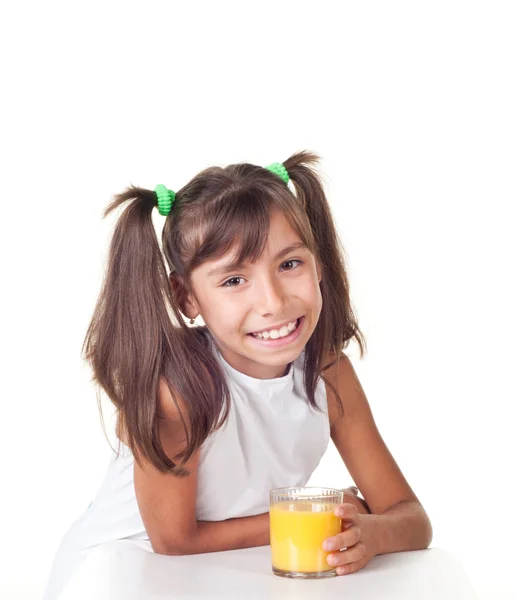 Cute little girl whith orange juice — Stock Photo, Image