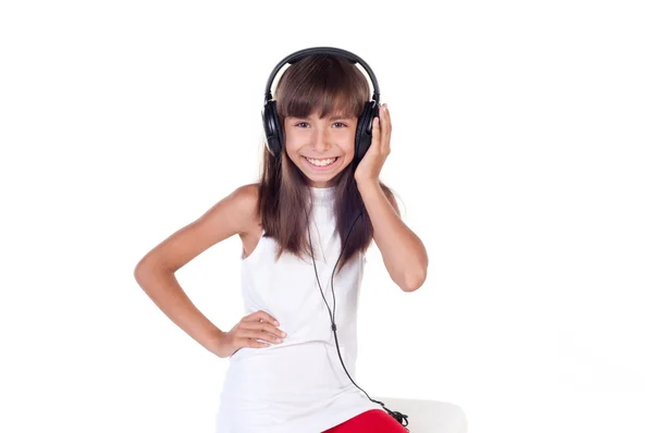 Piękny ładny szczęśliwy dziewczynka ze słuchawkami — Zdjęcie stockowe