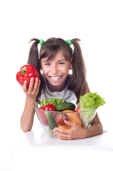 Beautiful little girl with vegetables — Stock Photo, Image