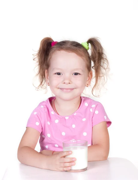 Cute little girl drinks milk — Stock Photo, Image