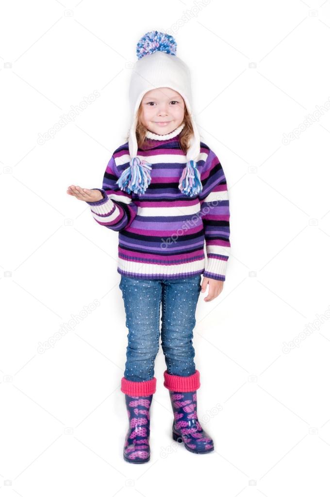 Little girl in winter clothes with empty hand