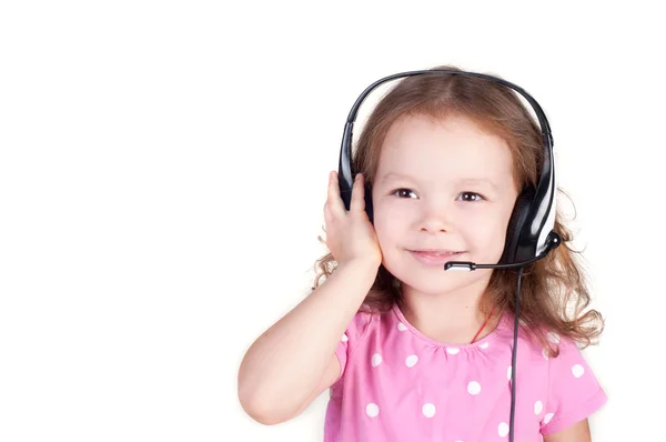 Schöne süße glückliche kleine Mädchen mit Kopfhörern — Stockfoto