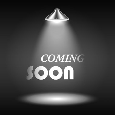 spot ışığı ile aydınlatılan metin coming soon