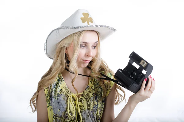 Girl and a polaroid camera — Stock Photo, Image