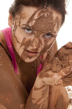 woman muddy intense face