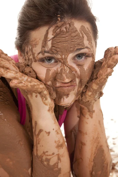 Woman muddy hands on face — Stock Photo, Image