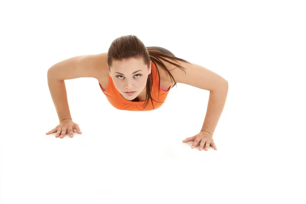 Vrouw push-up geconfronteerd met oranje — Stockfoto