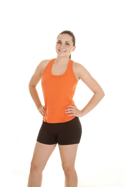 Kvinna orange skjorta stående — Stockfoto