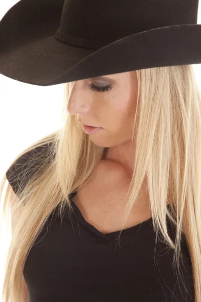 Cowgirl i svart titta ner — Stockfoto