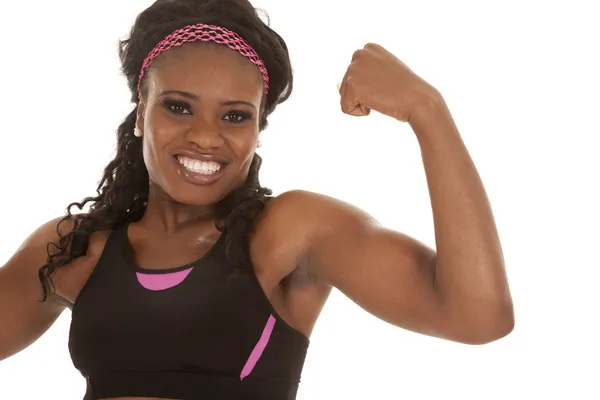 Woman showing arm muscles — Stock Photo, Image