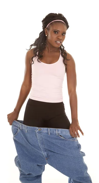 Mujer pantalones grandes serio — Foto de Stock