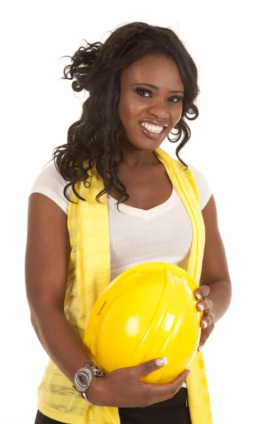 Woman hold yellow hard hat — Stock Photo, Image