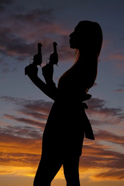 Woman dress guns silhouette blow — Stock Photo, Image